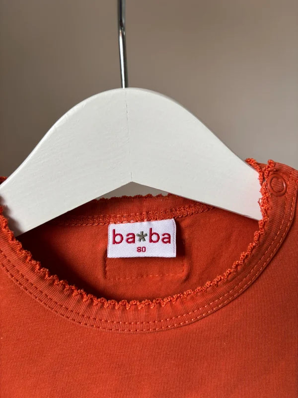 Oranje longsleeve met vogeltje