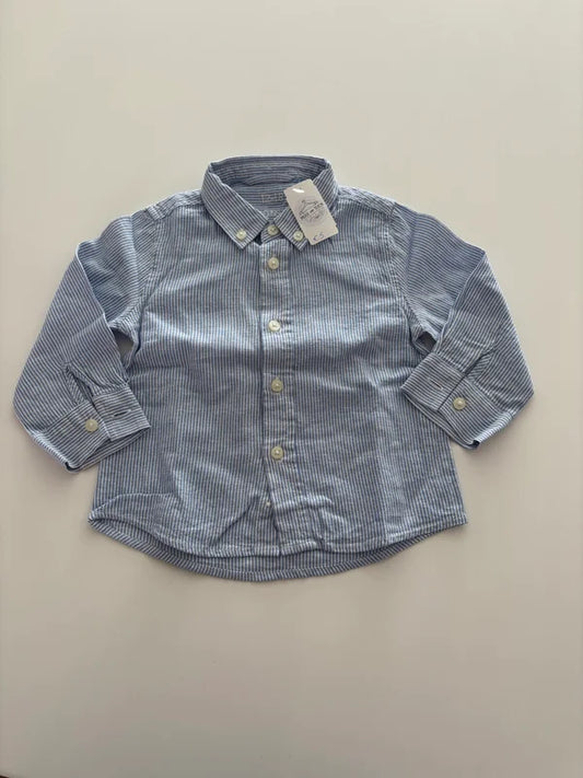 Lichtblauw gestreept hemdje